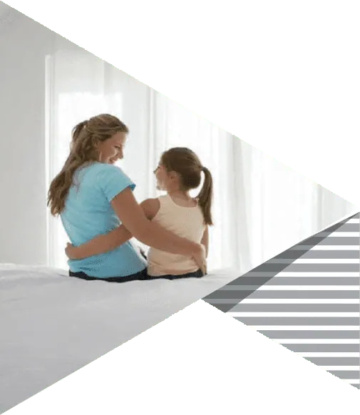 A mother and daughter sitting together in a bright room